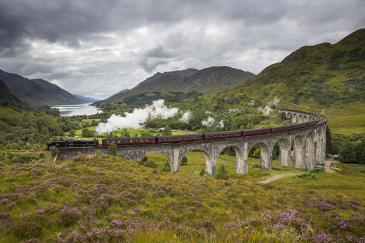The Jacobite steam train passing over the Glenfinnan Viaduct 