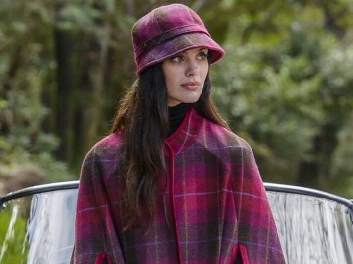 Woman in matching pink plaid hat and coat