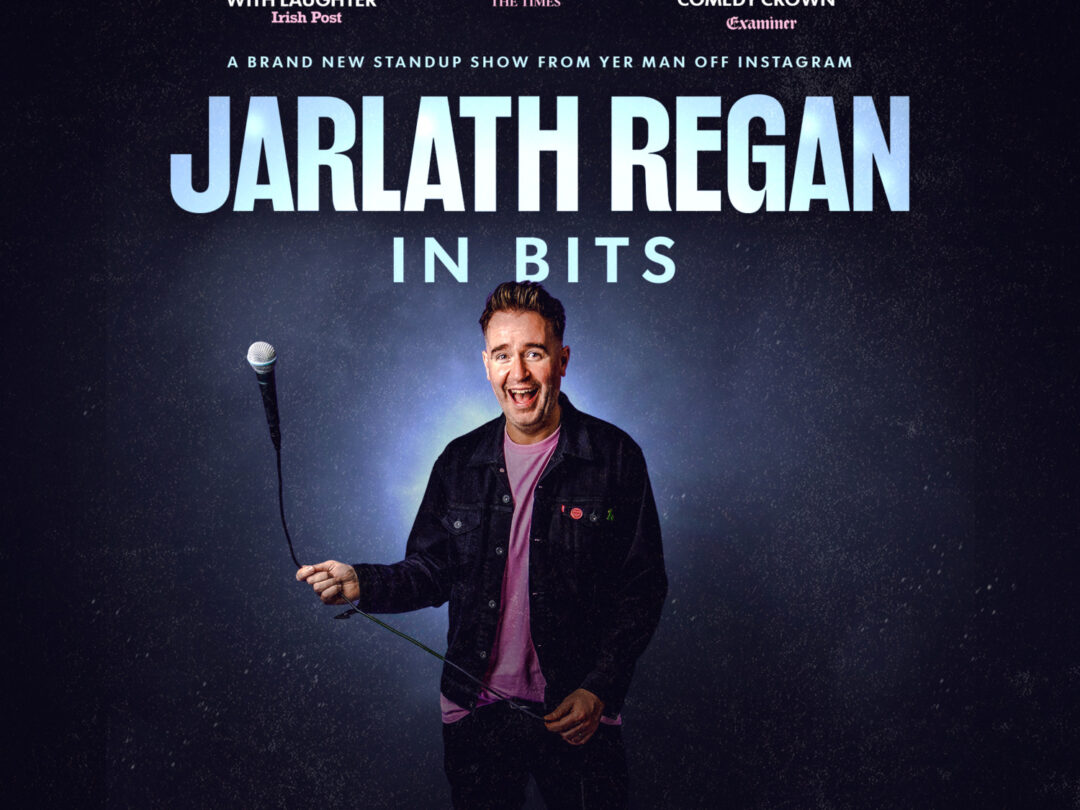A brand new stand up comedy show from Yer Man Off Instagram — Jarlath Regan: In Bits. Photo of Jarlath in a black jacket swinging a microphone
