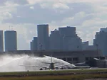 Water spraying over plane on tarmac