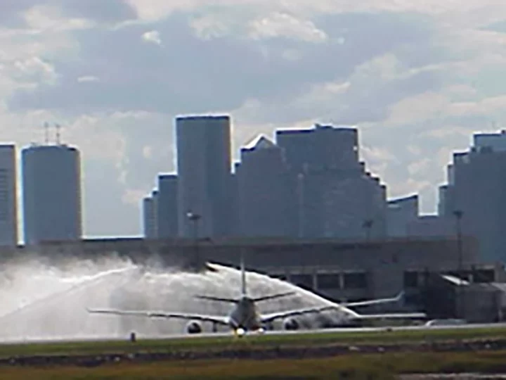 Water spraying over plane on tarmac
