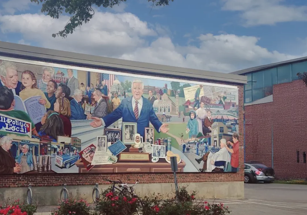 Mural painted on a brick building illustrating Tip O'Neill's interactions with the community