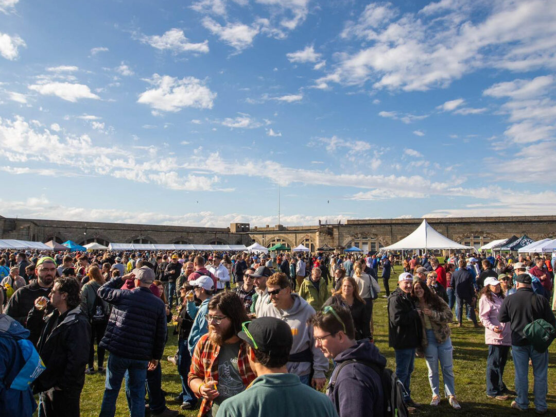 crowd photo at the beer festival under a bright blue sky