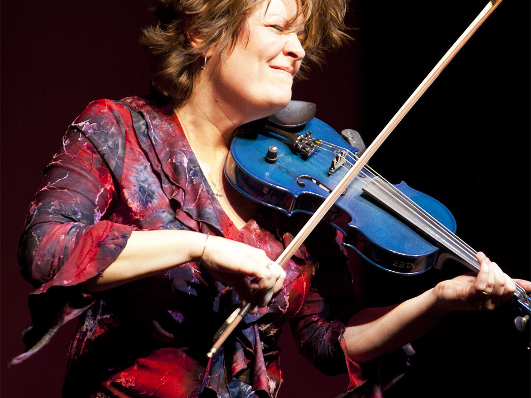 Eileen jamming on a blue violin (photo by Mel DiGiacomo)