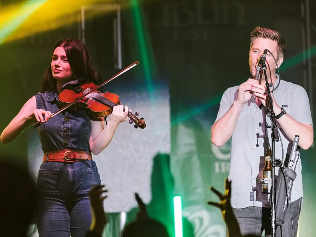 Band members playing on stage live