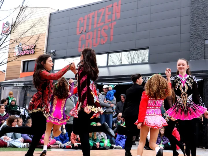 Irish Step Dancers performing outside Patriot Place storefronts