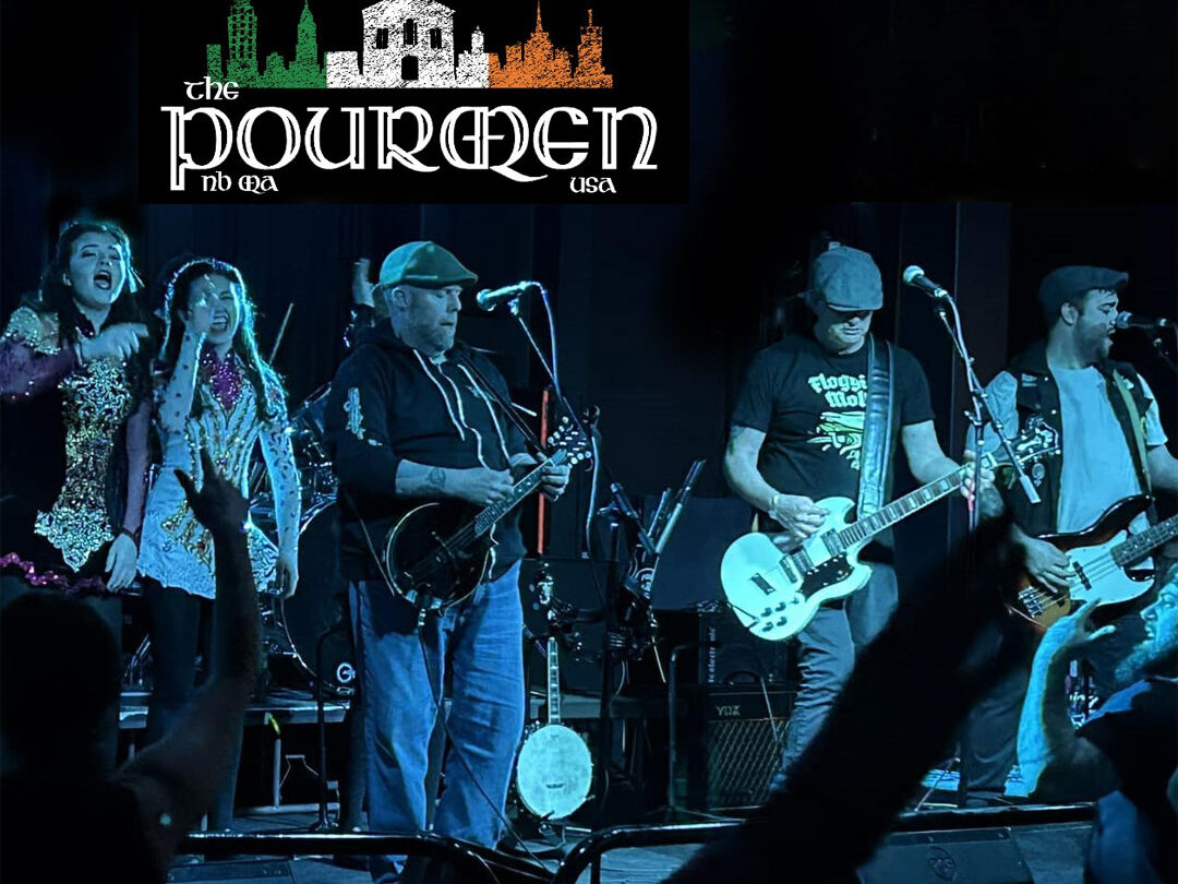 The pourmen band members on stage playing in blue light