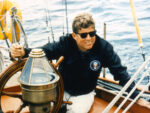 John F. Kennedy wearing sunglasses while Sailing off Cape Cod