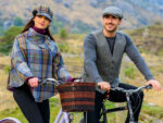 Woman and man riding bikes wearing wool hats and outerwear